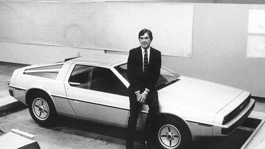 John DeLorean with his car.