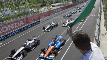 Jason Priestley waves the green flag to start the Honda Indy in Toronto on Sunday, July 15, 2018.