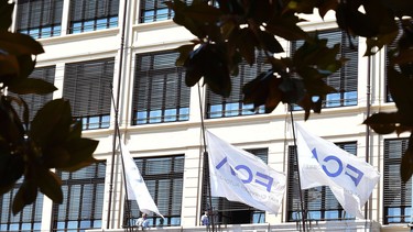 Flags are lowered at half staff at the FCA headquarters in Turin, Italy, Wednesday, July, 25, 2018. Sergio Marchionne, a charismatic and demanding CEO who engineered two long-shot corporate turnarounds to save both Fiat and Chrysler from near-certain failure, died Wednesday. He was 66. The holding company of Italian automaker Fiat's founders, the Agnelli family, announced Marchionne had died after complications from surgery in Zurich. At Fiat Chrysler Automobiles headquarters in the Italian town of Turin, flags flew at half-mast, while in Rome the parliamentary committee for labor and finance observed a minute of silence.