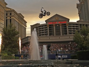 Travis Pastrana jumps the fountain at Caesars Palace on a motorcycle Sunday, July 8, 2018, in Las Vegas.