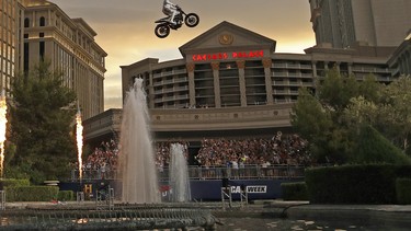 Travis Pastrana jumps the fountain at Caesars Palace on a motorcycle Sunday, July 8, 2018, in Las Vegas.