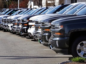 In this Monday, April 24, 2017, photo, GM pickup trucks are on display at Quirk Auto Dealers in Manchester, N.H.