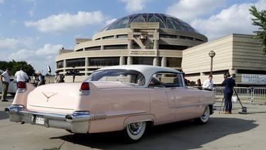 A pink Cadillac sits outside the Charles H. Wright Museum of African American History during a public visitation for legendary singer Aretha Franklin in Detroit, Tuesday, Aug. 28, 2018. Franklin died Aug. 16, 2018 of pancreatic cancer at the age of 76.
