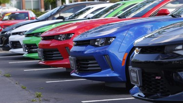 In this Wednesday, April 26, 2017, photo, Chevrolet Camaro sports cars are lined up in the lot of a Chevrolet dealership in Richmond, Virginia.