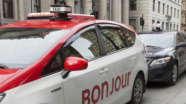 A taxi with Bonjour on the side is seen Thursday, November 30, 2017 in Montreal. The National Assembly is formally asking Quebec's merchants to "warmly" greet their clients with the word "Bonjour," and drop the old standard "Bonjour-hi."