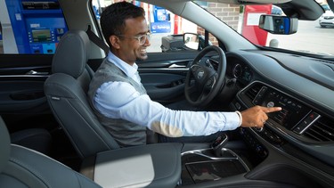 A driver using the Marketplace feature in a new Buick. This service allows drivers to pay for fuel from their vehicle without swiping their credit card or using their smartphone.