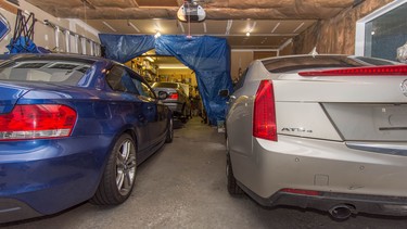 The Cadillac ATS is Bruce Borstmayer’s next project. Saved from the wrecker, he needs to fix the front bumper and light, get a salvage inspection done and then says he’s going to investigate dropping a GM LT4 V8 engine under the hood. His other modified project is the BMW seen in the third bay — it’s got an LS engine and is up on stands for some suspension upgrades.