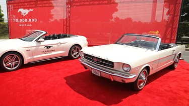 The 10 millionth Mustang sits alongside the first one built at an event at Ford's Flat Rock Assembly Plant on August 8, 2018, the day the milestone car was built.