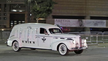 Swanson Funeral's 1940 LaSalle hearse with the gold casket of legendary singer Aretha Franklin leaves the Charles H. Wright Museum of African American History, late Tuesday, Aug. 28, 2018, in Detroit. Franklin died Aug. 16 and will be laid to rest on Friday after several days of tributes in Detroit.