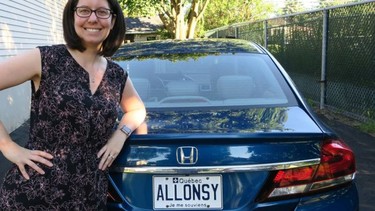 Vickie Louwet stands next to her ALL0NSY licence plate, which is among the first to be released in Quebec.