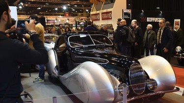 People walk around a 1939 Talbot-Lago T150 C SS "Goutte d'eau" designed by Figoni and Falaschi during the "Retromobile" old cars fair in Paris February 10, 2017.