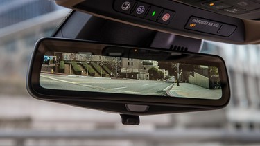 Cadillac's digital mirror shows a wide-angle view out the back.