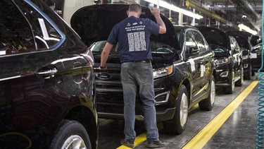 Ford Edge crossovers sit on a production line at the company's production plant in Oakville, Ontario.