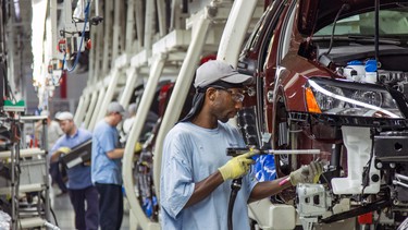 Workers assemble Volkswagen Passat sedans at the German automaker's plant in Chattanooga, Tenn.