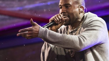 Kanye West performs during the World AIDS Day (RED) concert In Times Square in New York on Dec. 1, 2014.