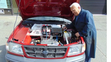 Joe Miszak with his self-charging, electric, ‘lunch bucket’ 1998 Subaru Forester purchased for $1,800.