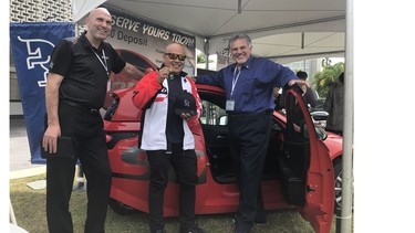 Electra Meccanica CEO Jerry Kroll, left, and U.S. director of operations Anthony Luzi flank Joe Cabrera after presenting him the keys to the first Solo delivered in the United States.