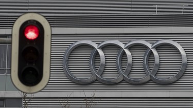 In this Wednesday, March 15, 2017 photo a traffic sign shows a red light in front of the Audi headquarters in Ingolstadt, Germany.
