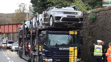 A fleet of Range Rovers being transported by truck had their roofs sheared off by a bridge in the Scotland late October 2018.