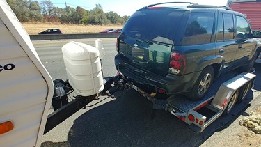 A photo of a vehicle pulling a trailer with a vehicle pulling a trailer.