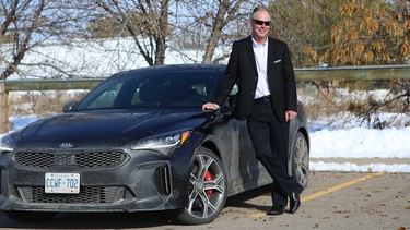 Gary Rokosh poses with a well-travelled 2018 Kia Stinger GT in Calgary.