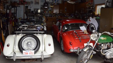 Before building this double attached heated garage in the late 1990s, enthusiast Gord McLellan had no space to work on his 1958 MGA, right. The 1969 Norton Commando, behind that car, was restored in his basement. With the garage built, McLellan has since added two vintage motorcycles and the 1954 MG TF to the collection.