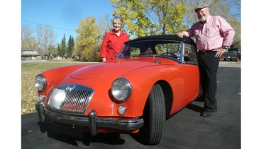 Dean and Joan Sandham with their pride and joy, a car they bought as students back in 1966.