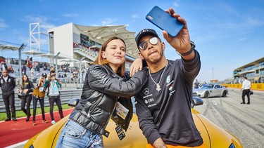 Lewis Hamilton and Millie Bobby Brown take a selfie ahead of a hot lap around the Circuit of the Americas.