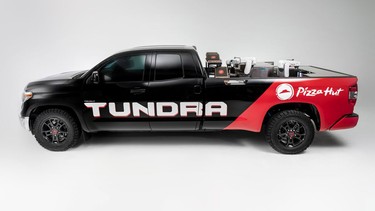 Toyota unveils a Tundra that makes and delivers pizza using robots in the bed