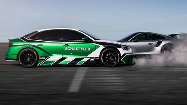 Daniel Abt driving his electric Audi RS3 in a drag race in reverse.