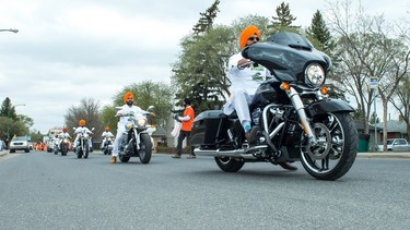 Men ride motorcycles during the Sikh Day Parade in Regina, Saskatchewan in 2018.