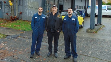 Doug Borden, who spent 35 years rebuilding engines at Alec’s Automotive, flanked by sons Rob and Kevin who now run the shop.