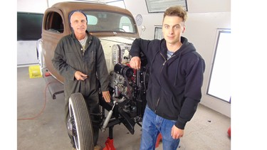Willy Fitzl gets guidance building his 1935 Ford three-window coupe hot rod from his 20-year-old son Tobin who is an expert metal shaper.