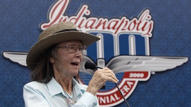 FILE - In this May 24, 2009 file photo, Mari Hulman George, chairman of the board of the Indianapolis Motor Speedway, gives the command to start engines at the start the 93rd running of the Indianapolis 500 auto race at the Indianapolis Motor Speedway in Indianapolis.  Hulman George, chairman of the board emeritus of the Indianapolis Motor Speedway, died early Saturday, Nov. 3, 3018. She was 83. Indianapolis Motor Speedway announced Hulman George’s death early Saturday in a statement and said her family was by her side.