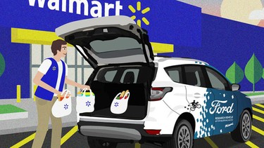 A mockup of an autonomous Ford being loaded with WalMart groceries.