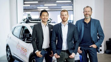 From left, Cruise Automation's Dan Kan and Kyle Vogt pose for a photo with General Motors' Dan Ammann at Cruise Automation offices in San Francisco, California.