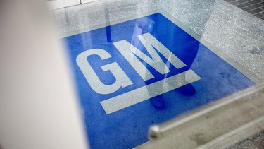In this Jan. 10, 2013, file photo, the logo for General Motors decorates the entrance at the site of a GM information technology center in Roswell, Georgia.