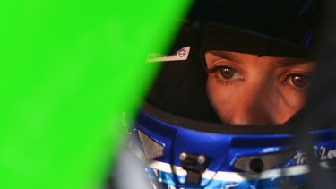 Danica Patrick, driver of the #10 GoDaddy Chevrolet, sits in her car in the garage area during practice for the NASCAR Sprint Cup Series FedEx 400.