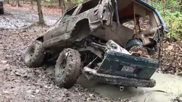 A Jeep Cherokee XJ folding itself in half.