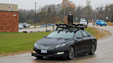 The University of Waterloo's "Autonomoose" Lincoln showing off its wet-weather capabilities