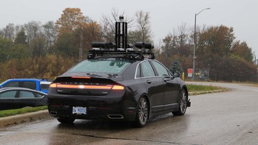 The University of Waterloo's "Autonomoose" Lincoln showing off its wet-weather capabilities