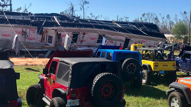 The home of Dereck and Andrea Clifton are the owners of the sideways motorhome, which had been blown onto its side by 210 km/h winds. Luckily for them, about a dozen Jeeps showed up, hooked up their winches, and pulled the home down.