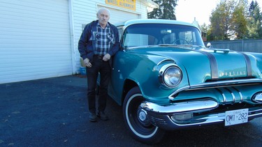 George Perkin with the 1955 Pontiac he did a complete off-frame restoration on.