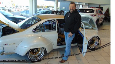 Rod Nielsen with his award-winning customized Mazda R100 that took top honours at the SEMA show in Las Vegas.