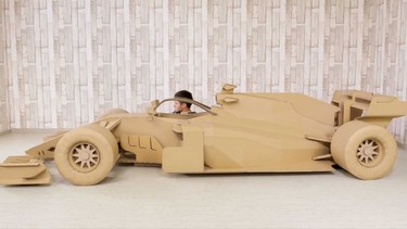 A nearly-full-scale cardboard replica of an an F1 car, built by the Q
