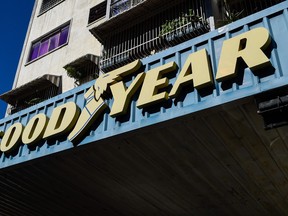 The logo of US tire manufacturer Goodyear is seen at a garage in Caracas, on December 11, 2018.