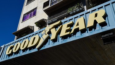 The logo of US tire manufacturer Goodyear is seen at a garage in Caracas, on December 11, 2018.