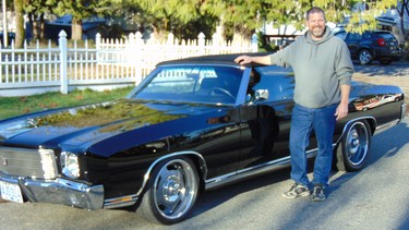 Grant Pennock with the 1970 Chevrolet Monte Carlo passed down from his grandfather and father now customized as a convertible.