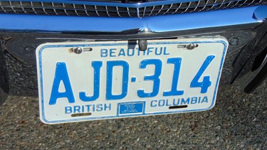 A British Columbia license plate from the year of manufacture is displayed on the classic.