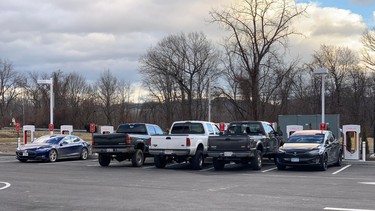 A photo posted by a Reddit user of a group of trucks "ICE-ing" a Supercharger station